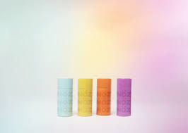 Display showing 4 of NOZ’s many different colors of sunscreen.